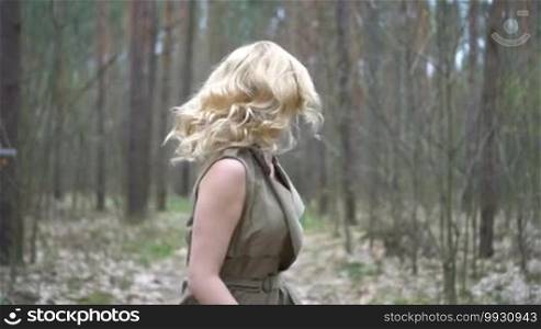 Blonde woman in the forest running