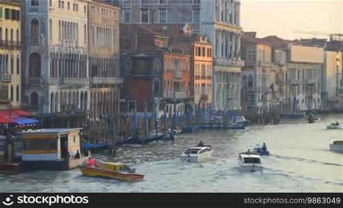 Boats are sailing in a canal in Venice