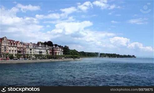 Bodensee, known for its location in the tri-border area of Germany, Austria, and Switzerland from Konstanz, with its classic preserved lakeside promenade on a sunny day with blue sky