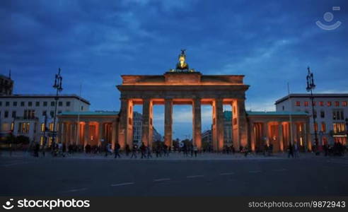 Brandenburg Gates in Berlin with crowd and urban transport timelapse