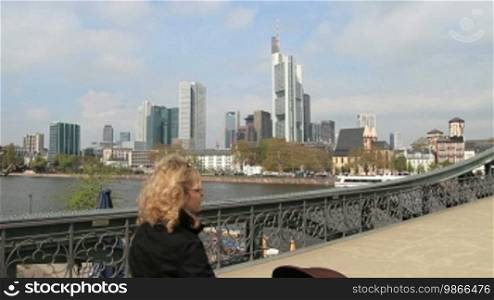 Bridge with a view of the skyline, from Frankfurt am Main.