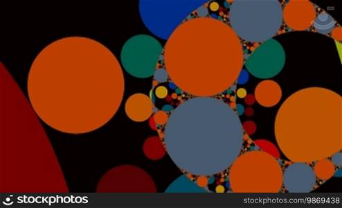 Bright color circles and rings rotate on a black background.