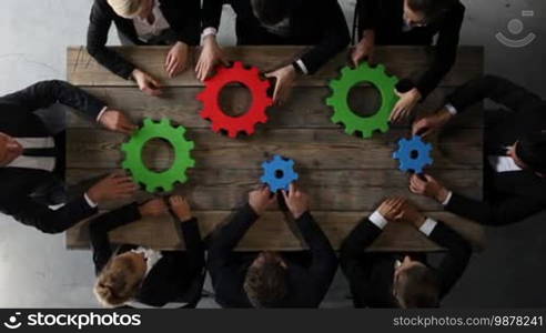 Business people with colorful cogs of business, problem solution concept