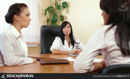 Business women are discussing in a meeting