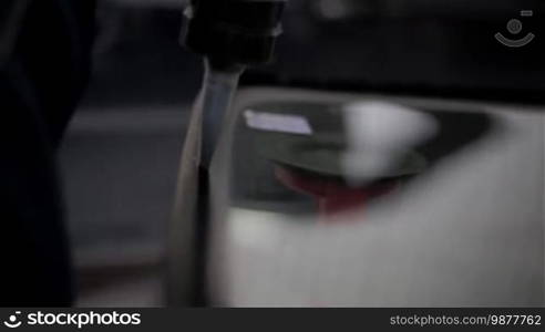 Car glass replacement at an auto repair shop