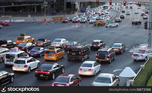 Cars at a busy intersection in Las Vegas, shot at dusk