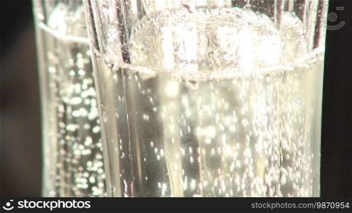 Champagne sparkles in a glass.