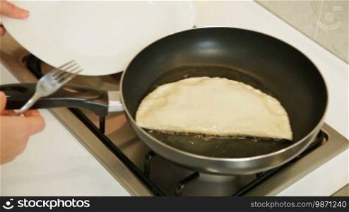 Chebureki preparation - Fry both sides in a heavy hot pan in oil