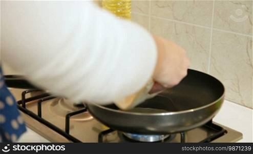 Chebureki preparation - fry both sides in a heavy hot pan in oil on medium heat