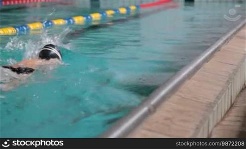 Child competing in a swimming race