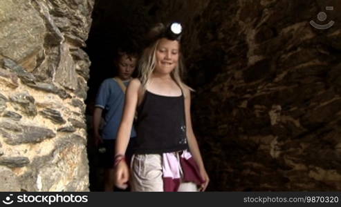 Children explore secret passage