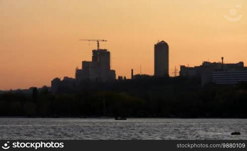 City landscape with skyscrapers on river Dnepr.