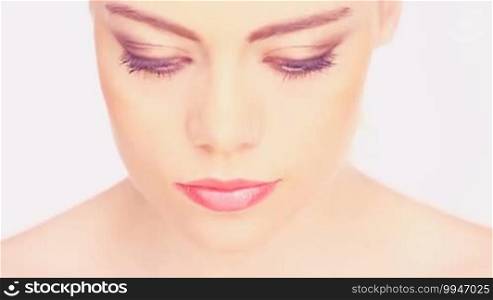 Close up of an attractive woman with full makeup on.
