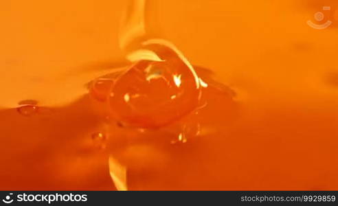 Close up of pouring honey on honey