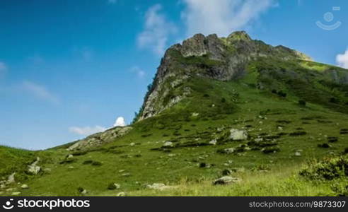 Clouds in blue sky and Caucasus mountains time lapse