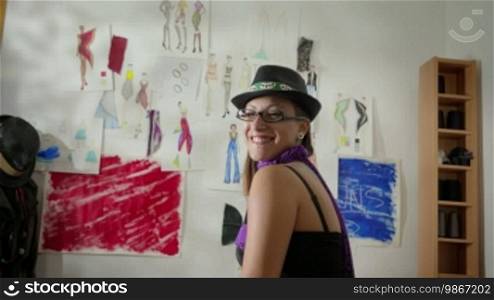 Confident and successful self-employed young people, portrait of happy Caucasian woman at work as a fashion designer and tailor in the studio