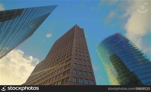 Corporate buildings on Potsdamer Platz in Berlin, time lapse, low angle view