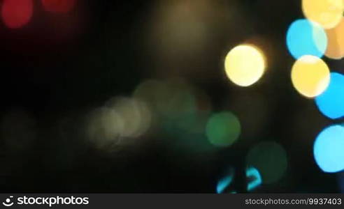 Defocused lights of Christmas tree. Colorful xmas bokeh