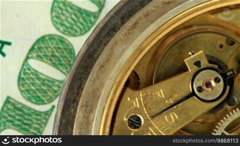 Dollar and the old pendulum clock. Loopable.