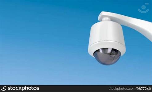 Dome security camera against blue sky
