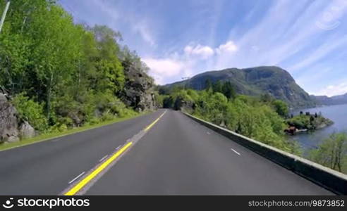 Driving a Car on a Road in Norway