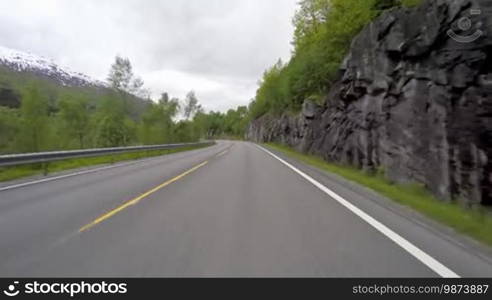 Driving a Car on a Road in Norway