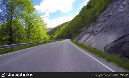 Driving a Car on a Road in Norway