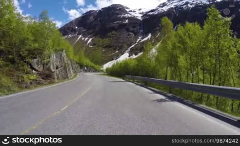 Driving a Car on a Road in Norway