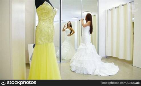 Elegant Bride Trying On Wedding Dress in Bridal Boutique, Long Shot