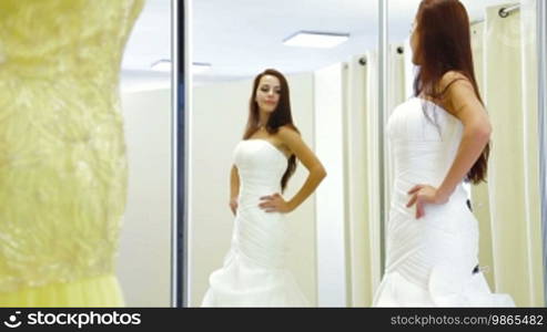 Elegant Bride Trying On Wedding Dress in Bridal Boutique, Medium Shot