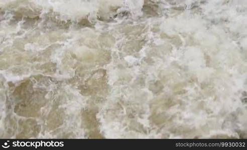 Fast flowing water on the river