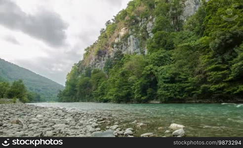 Fast mountain river with stones and rocks around