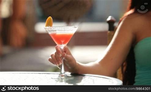 Female hand with martini glass