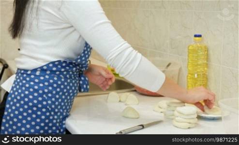 Female Hands Making Dough For Meat Pie On Counter Top