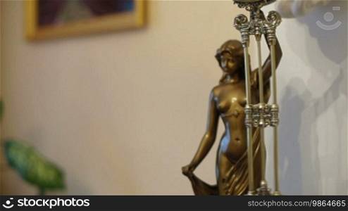Figural pendulum swing clock, bronze figure of a woman