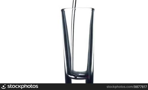 Filling a glass of water on white background. Healthy and fresh water