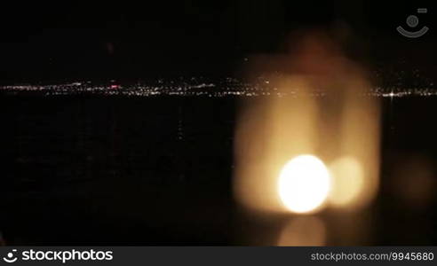 Focus pulling from blur to kerosene lantern. Close up.