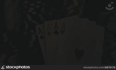 Four Aces On Poker Chips. Poker Table With Chips In Casino