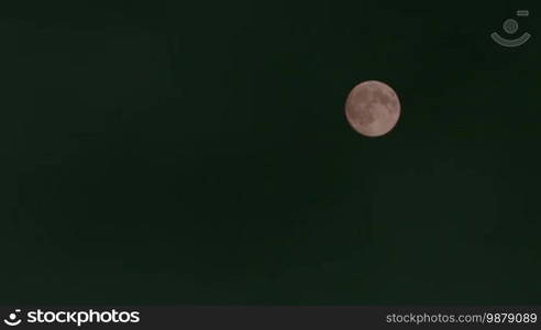 Full Moon Moving Over Clouds