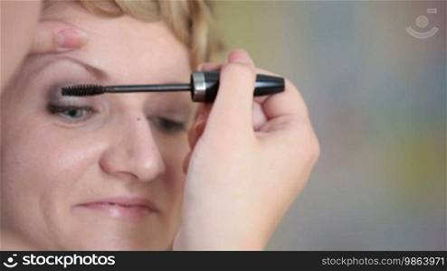 Girl having makeup applied