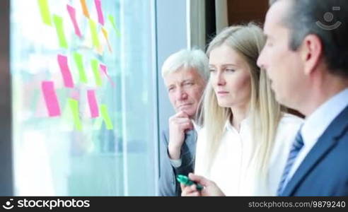 Group of business people brainstorming ideas. Entrepreneurs having a standing meeting discussing ideas strategy planning problem solution concept