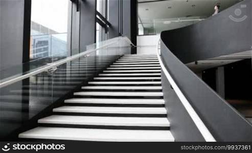 Group of business people walking down the stairs