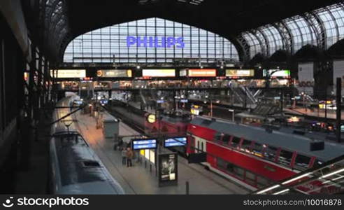 Hamburg - May 30: Central railway station with large Philips logo, trains and moving passengers on May 30, 2012 in Hamburg, Germany.