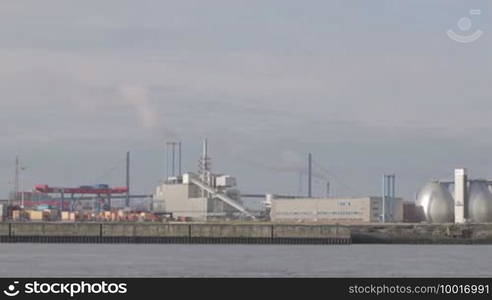 Hamburg port at the early fog morning. Power stations, cargo containers.