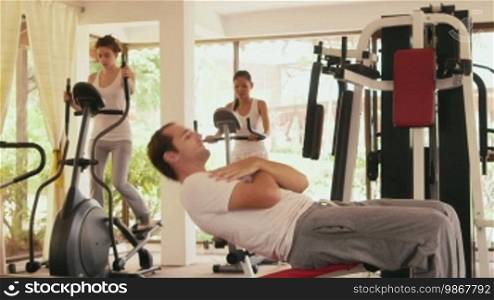 Happy young people, fun, leisure, lifestyle, fitness, sport and exercising, men and women working out in the gym. 13 of 27