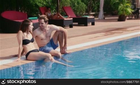 Happy young people, fun, leisure, lifestyle, vacations and relax near resort swimming pool, portrait of boyfriend and girlfriend looking at camera. 10 of 27