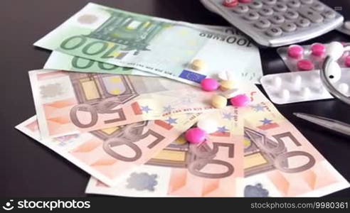 Health costs concept - pills and euro money