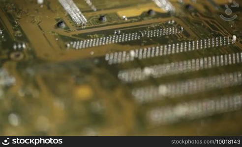 High technology background, computer circuit board. Focus pulling macro shot.