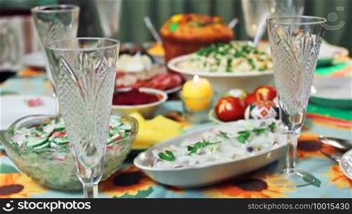 Holiday table at Easter in Ukrainian style, focusing on glass, and then to cake