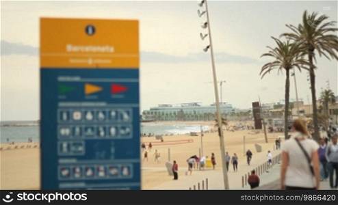 Information sign on the beach promenade of Barcelona